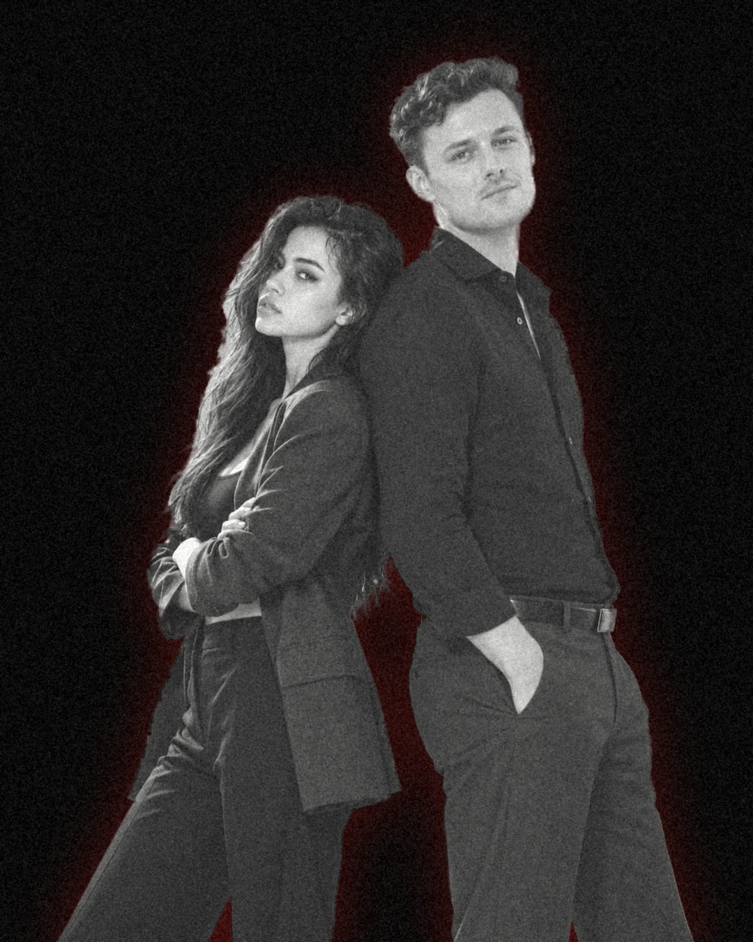 Pat Villaceran and Nathan Reardon stand back to back. She wears a charcoal blazer. He wears a black shirt.